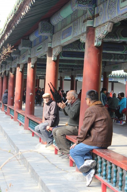 Chinese local playing music in the long corridor east of the Hall of Prayer for Good Harvests