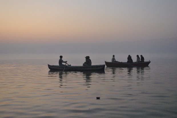 Rowing boats on the Ganges in Varanasi at sunrise