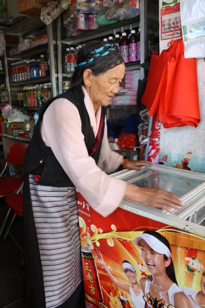 Elderly lady in a small shop next to the Sera Monastery in Lhasa, Tibet.