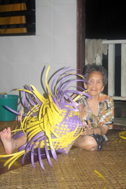 Local woman in an Iban Longhouse in Sarawak, Malaysian Borneo