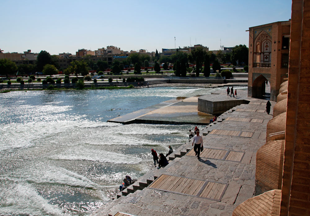 The stairs on the downstream side of the Khaju Bridge in Isfahan, Iran lead directly down to the water