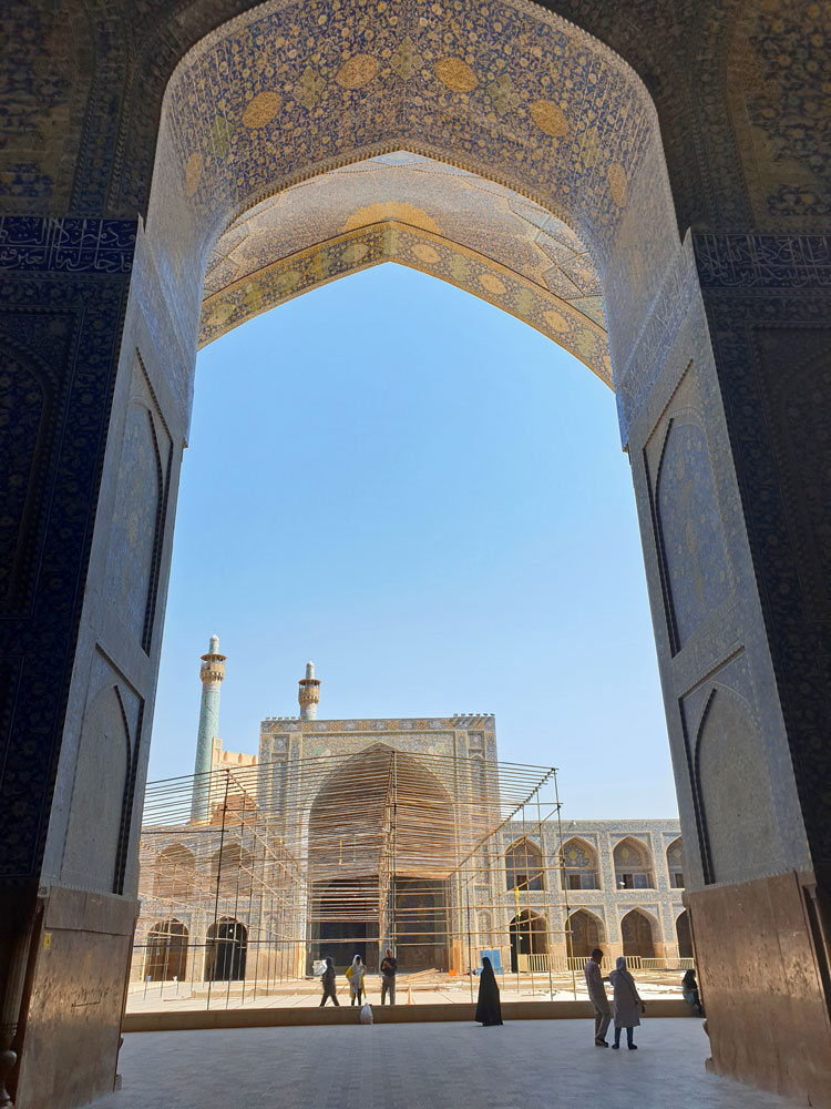 Archway overlooking an inner courtyard of the Shah Mosque in Isfahan, Iran