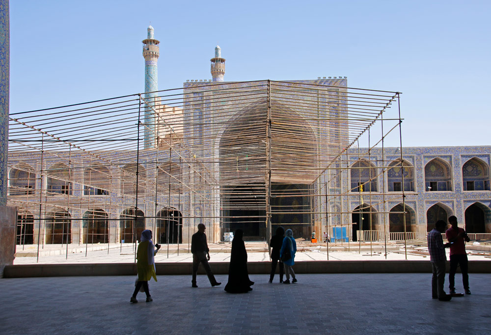 Inner courtyard of the Shah Mosque with scaffolding in Isfahan, Iran