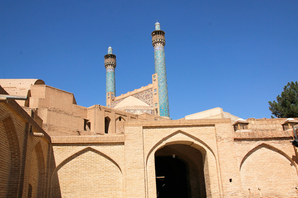 View of two minarets from a courtyard of the Shah Mosque in Isfahan, Iran